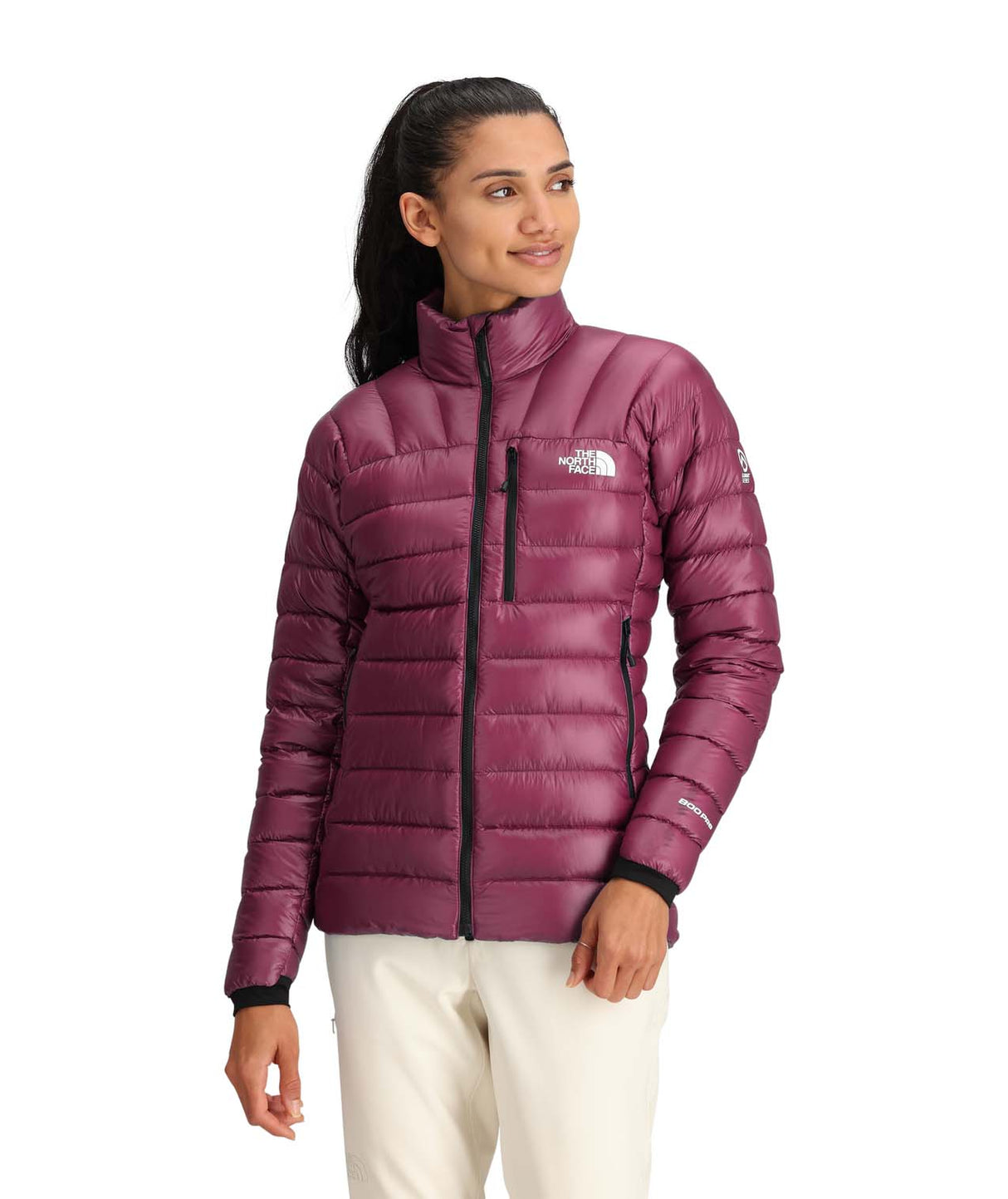 WSummitBreithornJacket-Woman wearing a purple puffer jacket with The North Face logo on a white background