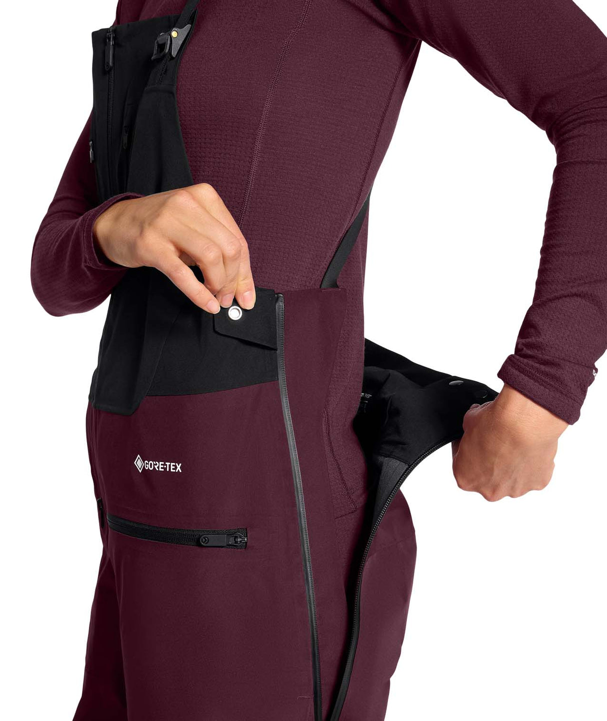 WSummitVerbierGTXBib-Maroon snow pants with black zippers and a visible brand logo on a white background