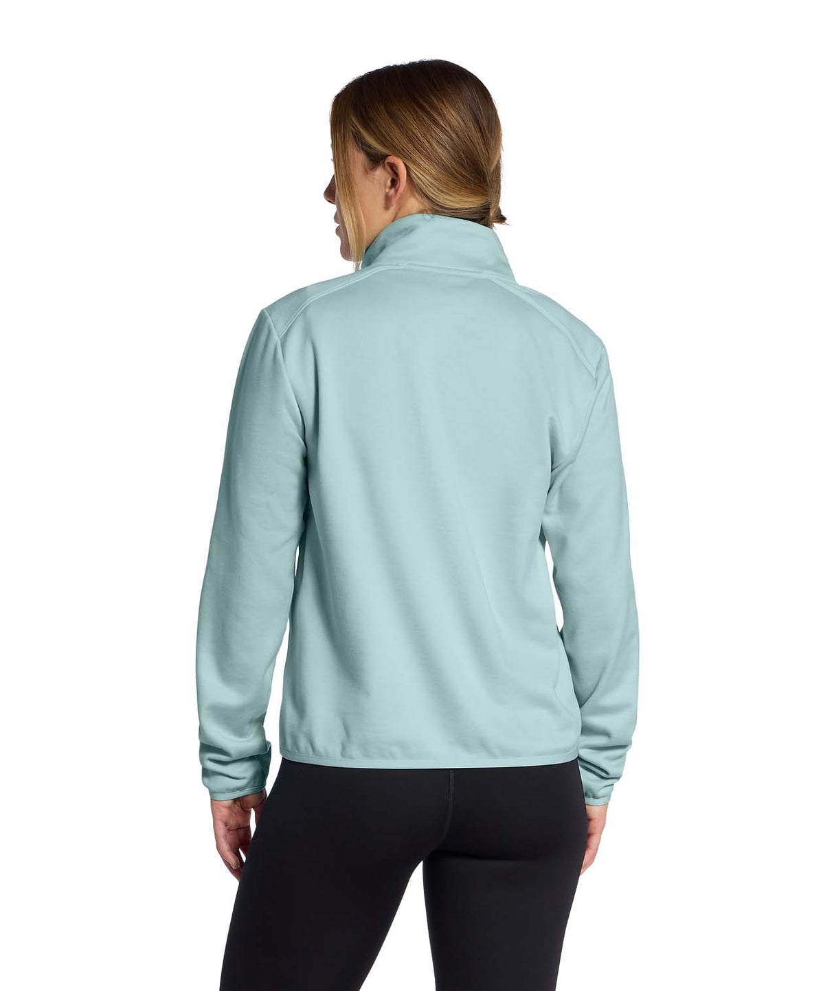 WTNFPerformanceFleece1_4Zip- Person wearing a light blue quarter zip with white North Face Logo on a white background