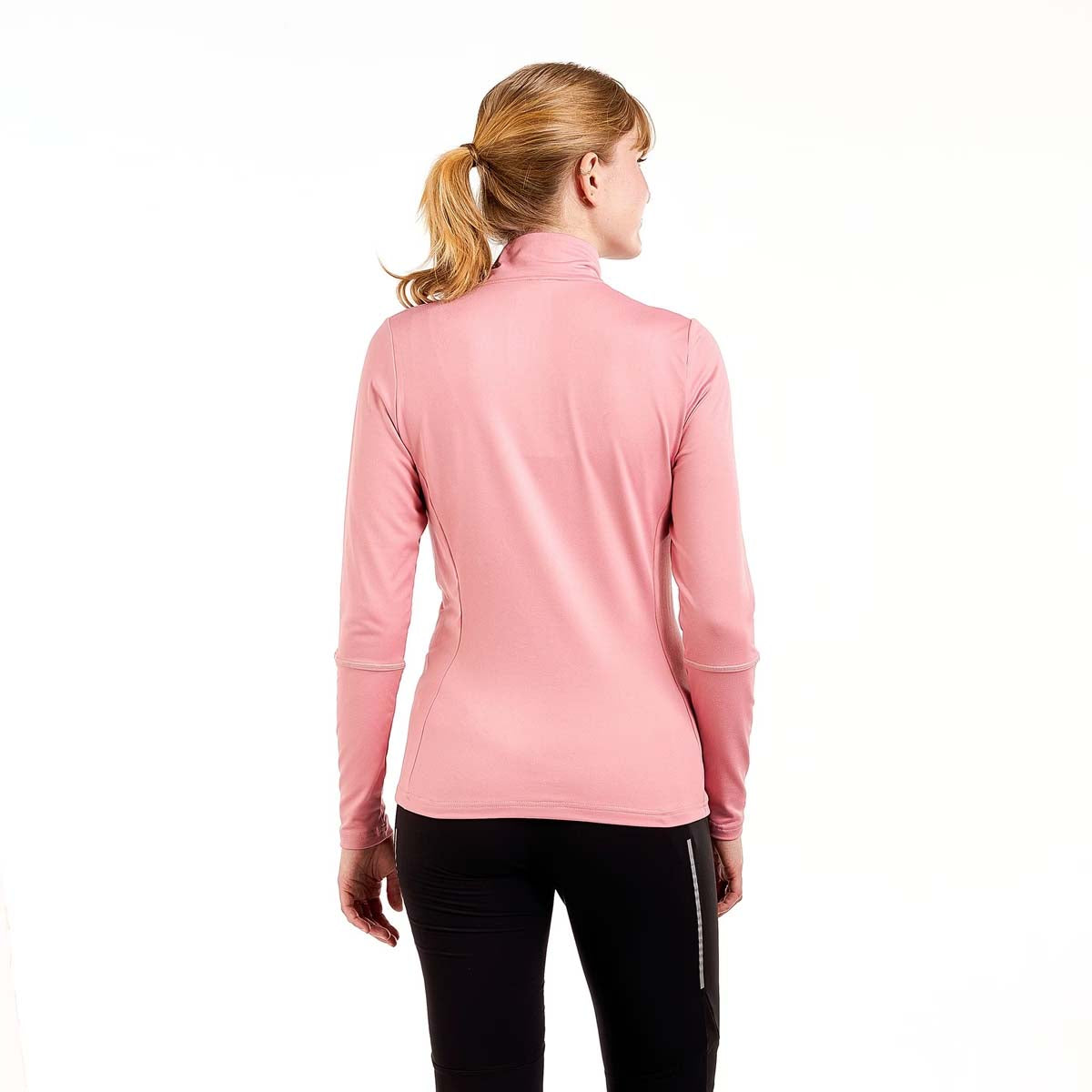 WTista1_2ZipMidlayer- A woman modeling a pink long-sleeve half-zip athletic top with a white zipper pull, paired with black leggings, against a plain white background.