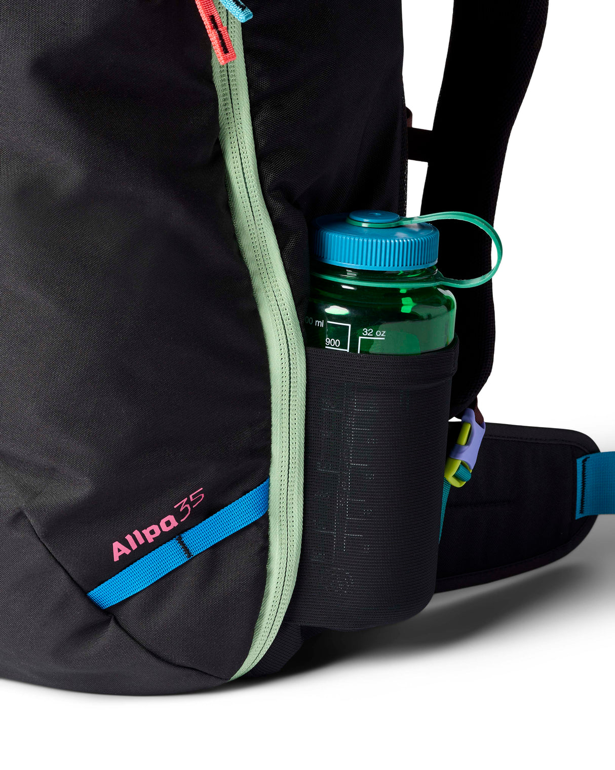 allpa-35l-travel-pack-A black Cotopaxi backpack with a pink llama logo on the front, accented with bright blue, purple, and multicolor zipper details, shown on a white background.