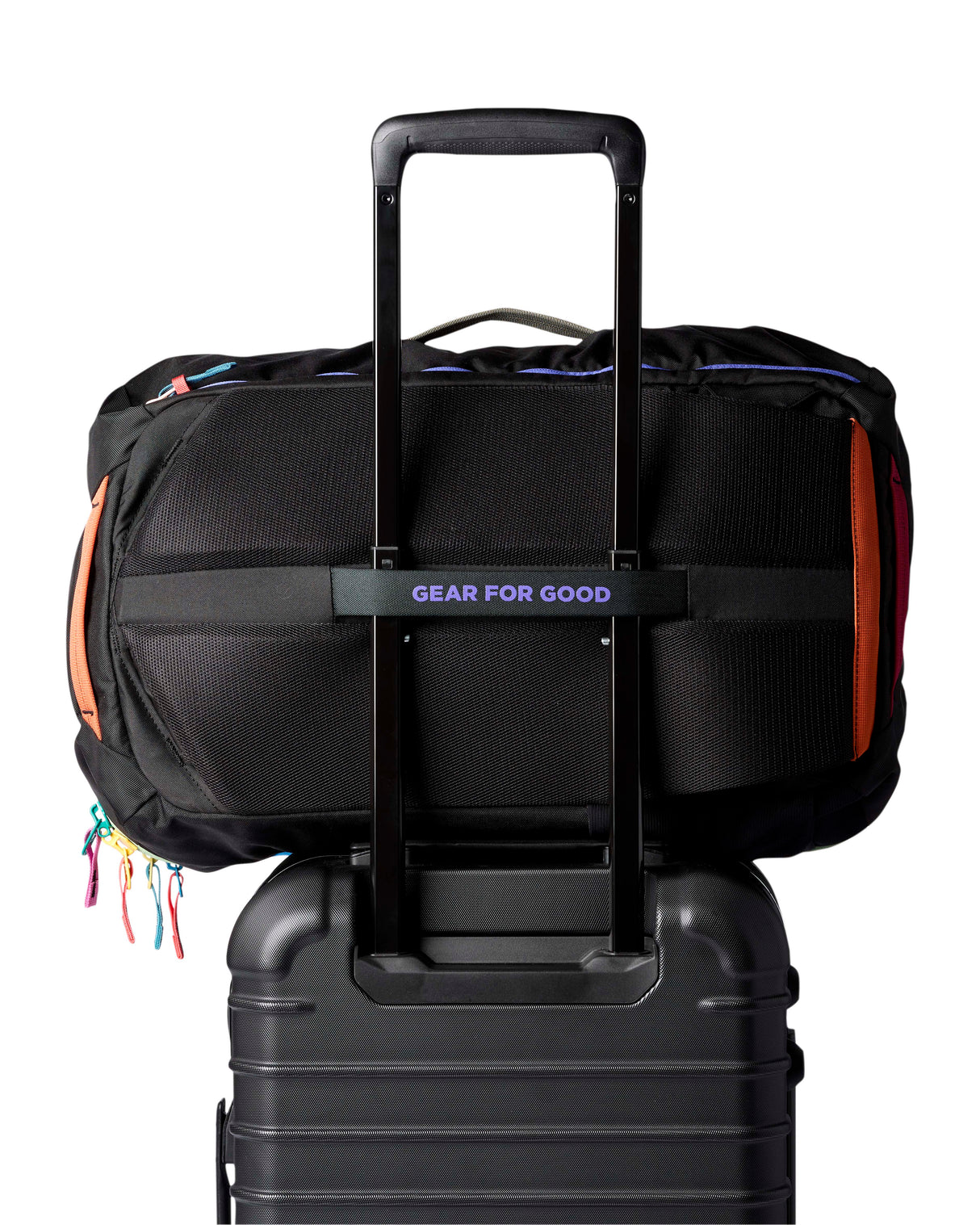 allpa-35l-travel-pack-A black Cotopaxi backpack with a pink llama logo on the front, accented with bright blue, purple, and multicolor zipper details, shown on a white background.