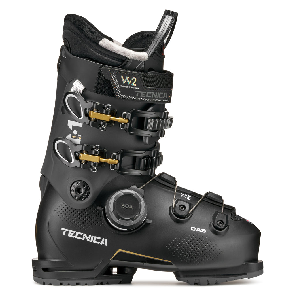 MACHBOAHV75-Black Tecnica ski boot with gold accents on a white background