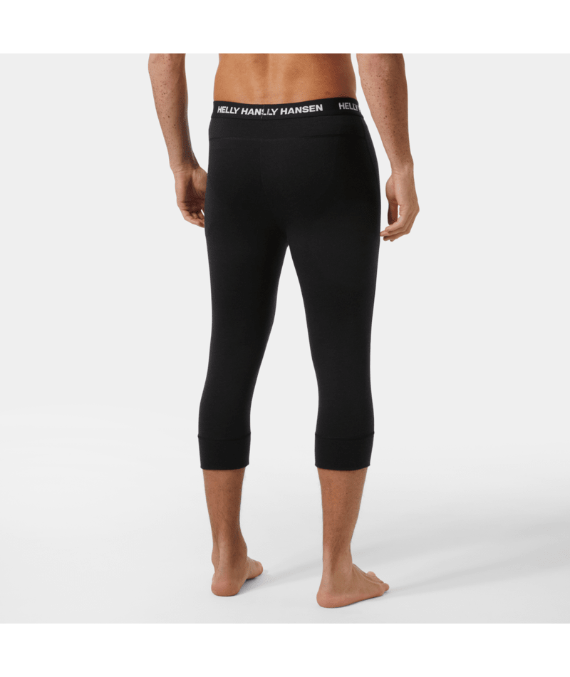 Lifa Merino MW 3/4 Pant-Person wearing black leggings with a visible brand logo on a white background