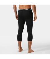 Lifa Merino MW 3/4 Pant-Person wearing black leggings with a visible brand logo on a white background