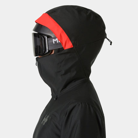 Powderqueen 3.0 Jacket-A woman wearing a black Helly Hansen Powderqueen 3.0 ski and snowboard jacket with a hood.