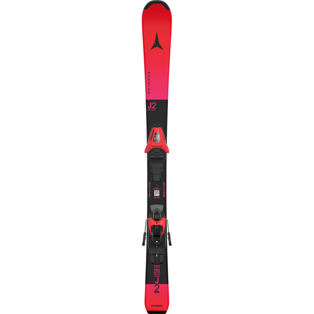 Redster J2- A pair of red Atomic Redster J2 kids skis with black bindings, designed for smooth progression and confident control on groomed terrain.