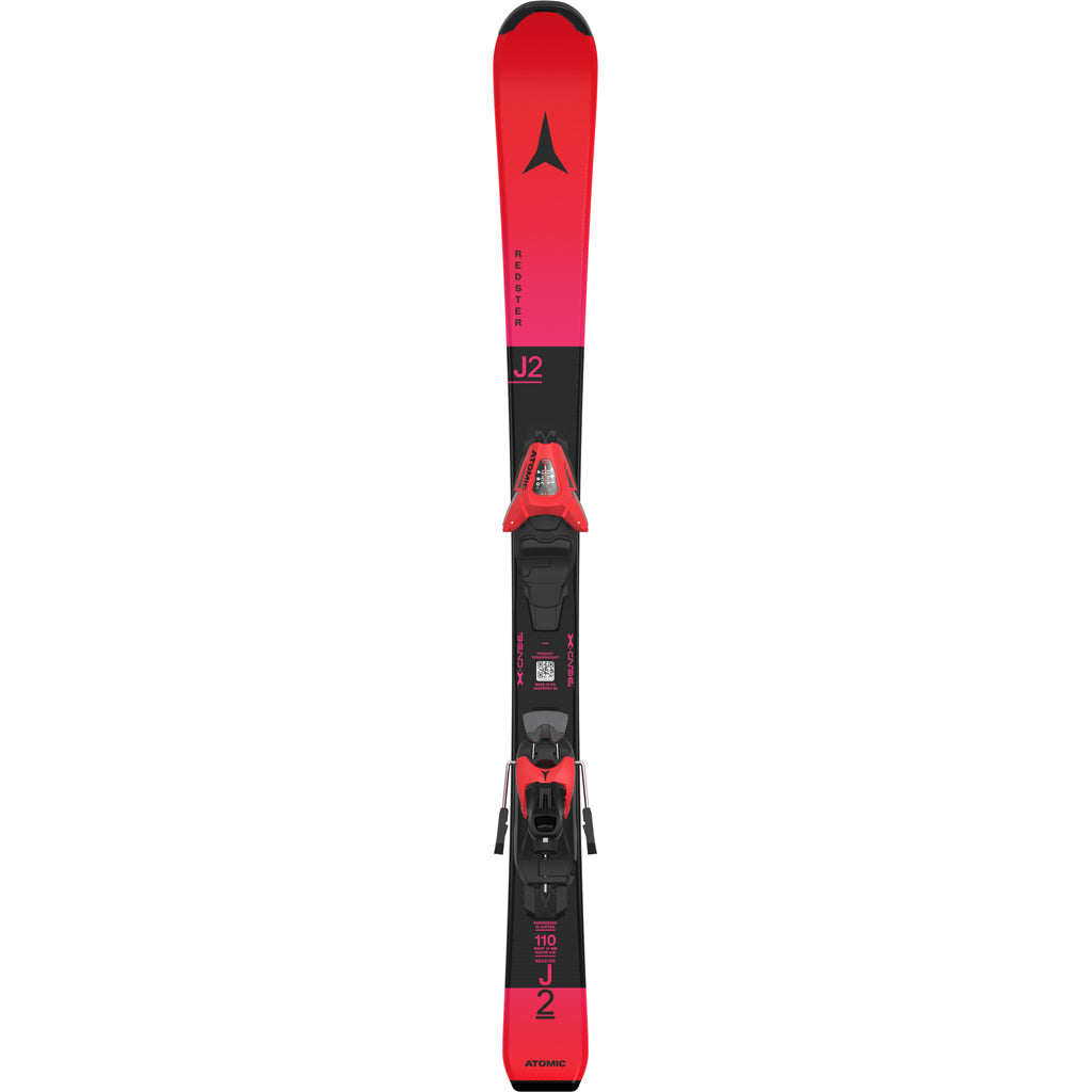 Redster J2- A pair of red Atomic Redster J2 kids skis with black bindings, designed for smooth progression and confident control on groomed terrain.