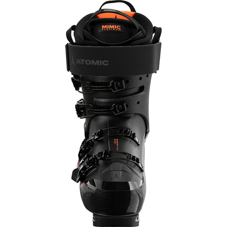Hawx Magna XTD 120-A pair of Atomic Hawx Magna XTD 120 GW men's ski boots in black with orange accents, featuring a high-top design and multiple buckles.
