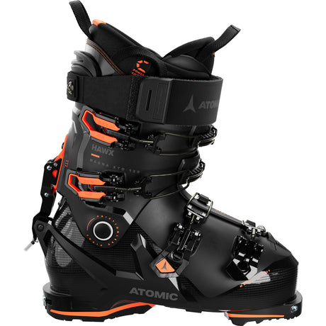 Hawx Magna XTD 120-A pair of Atomic Hawx Magna XTD 120 GW men's ski boots in black with orange accents, featuring a high-top design and multiple buckles.
