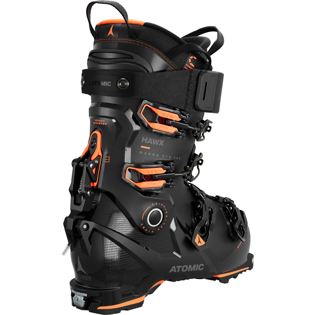 Hawx Magna XTD 120-A pair of Atomic Hawx Magna XTD 120 GW men's ski boots in black with orange accents, featuring a high-top design and multiple buckles.