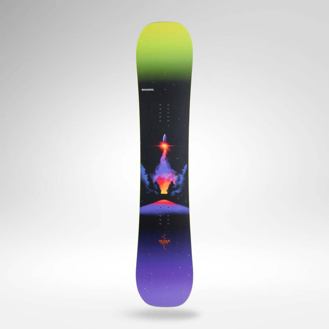 Alias-A snowboard with a vibrant cosmic design, featuring a black background with a green-to-purple gradient at the top and bottom, and a colorful rocket launching from an erupting volcano in the center. The brand name 'ROSSIGNOL' is visible near the top.