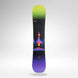 Alias-A snowboard with a vibrant cosmic design, featuring a black background with a green-to-purple gradient at the top and bottom, and a colorful rocket launching from an erupting volcano in the center. The brand name 'ROSSIGNOL' is visible near the top.