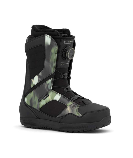 Anthem- Black and green snowboard boot on a white background