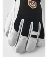 ArmyLeatherPatrol-Pair of black and white gloves with a logo on a white background