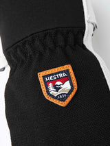 ArmyLeatherPatrolMitt-Pair of white and black mittens with a visible brand logo on a white background