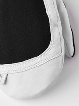 ArmyLeatherPatrolMitt-Pair of white and black mittens with a visible brand logo on a white background