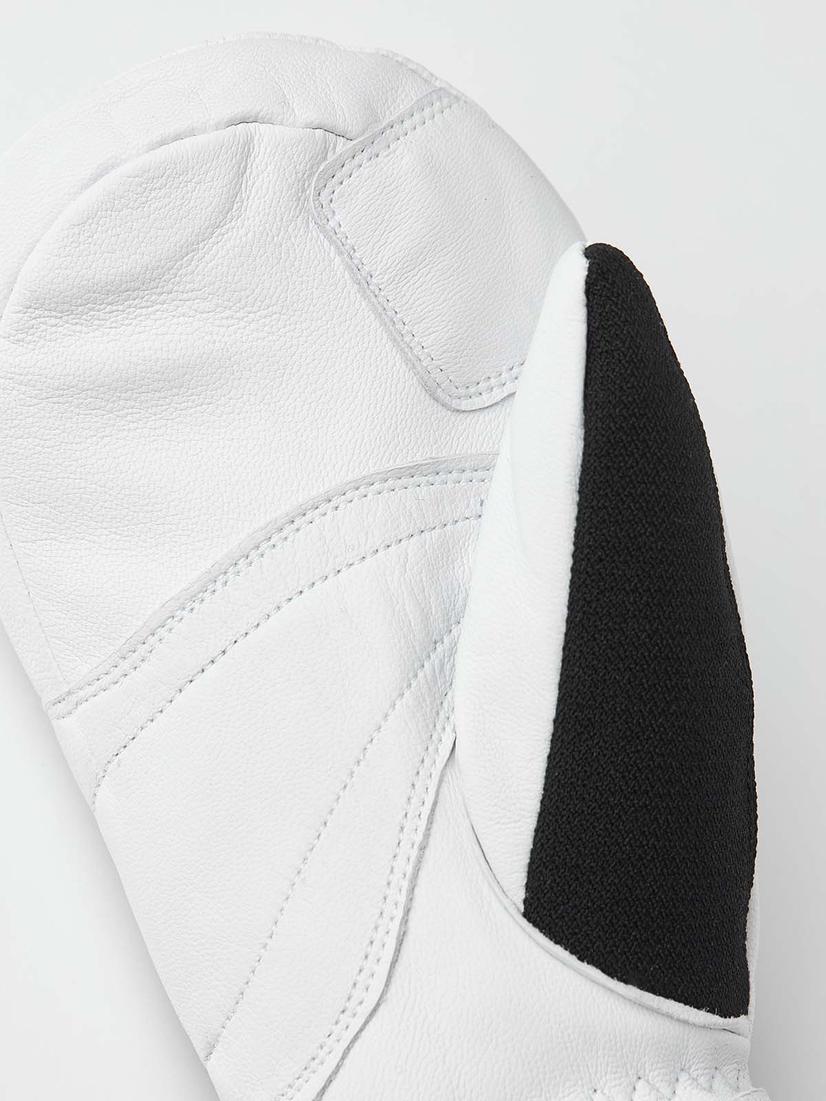 ArmyLeatherPatrolMitt-Pair of white and black mittens with a visible brand logo on a white background