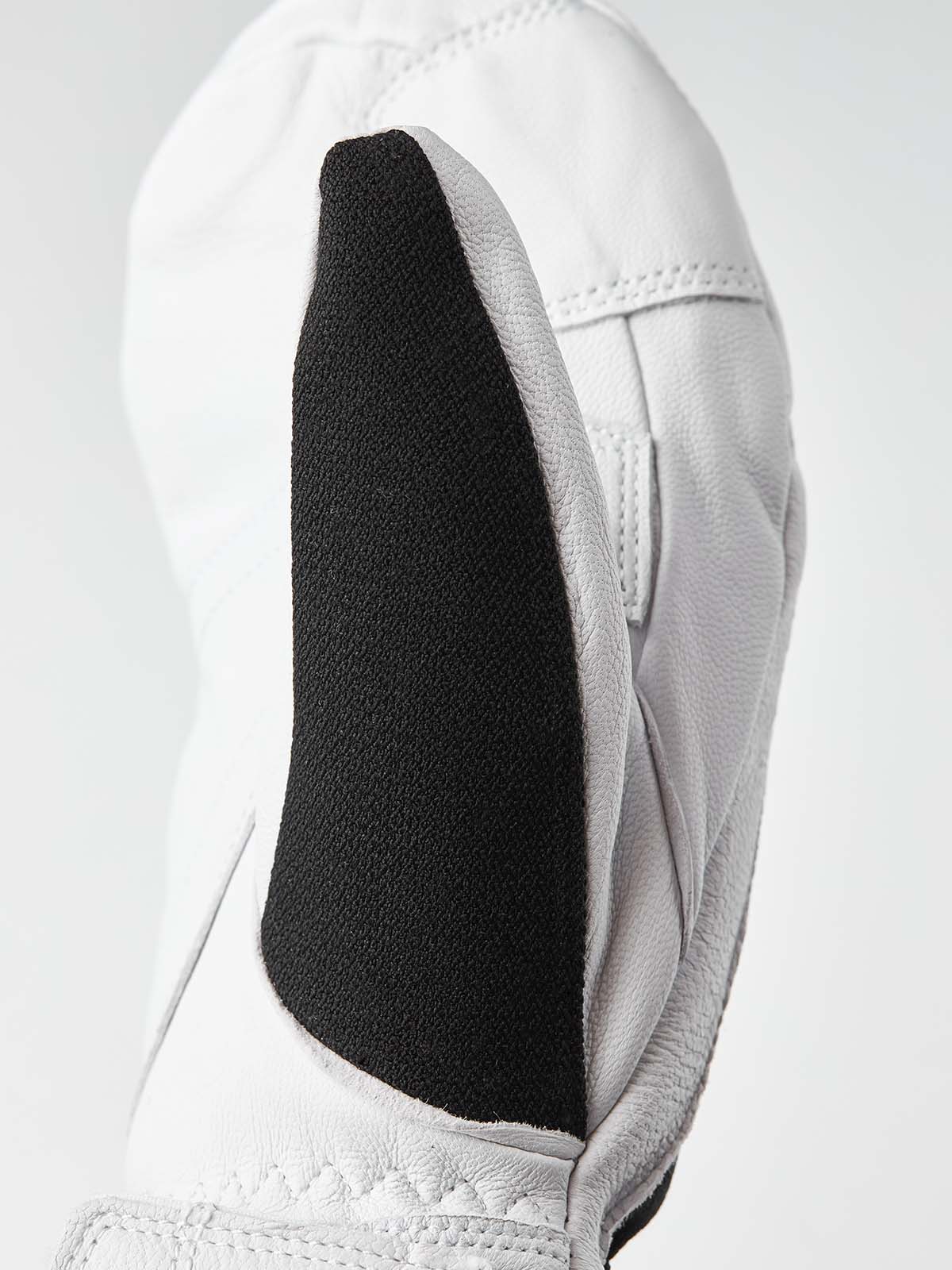 ArmyLeatherPatrolMitt-Pair of white and black mittens with a visible brand logo on a white background