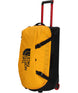 BaseCampRollingThunder_28-Yellow rolling duffel bag with black accents and The North Face logo on a white background