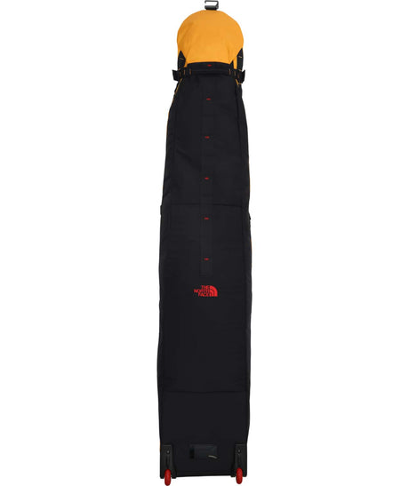 BaseCampSnowRoller-Yellow snowboard bag with The North Face logo on a white background