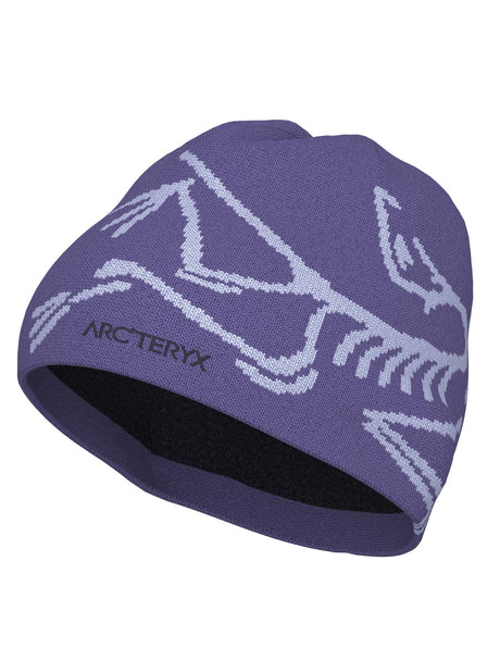 BirdHeadToque-A dark purple knit beanie hat featuring a light purple knit Arc'teryx bird logo and the brand name 'ARC'TERYX' on the side, with a black fleece lining visible at the opening.
