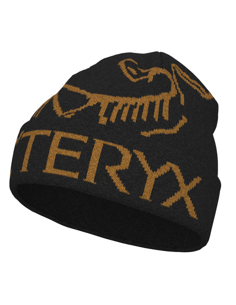 BirdWordToque-A black knit beanie featuring the Arc'teryx wordmark and bird logo in tan/golden brown, shown on a plain white background.