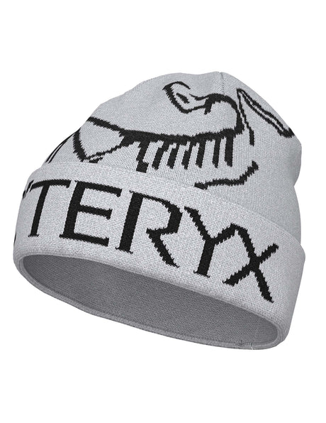 BirdWordToque-A light gray knit beanie hat featuring a black knit Arc'teryx bird logo and the brand name 'ARC'TERYX' across the front cuff.