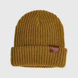 ChunkBeanie-Brown knit beanie with a leather patch on a light gray background