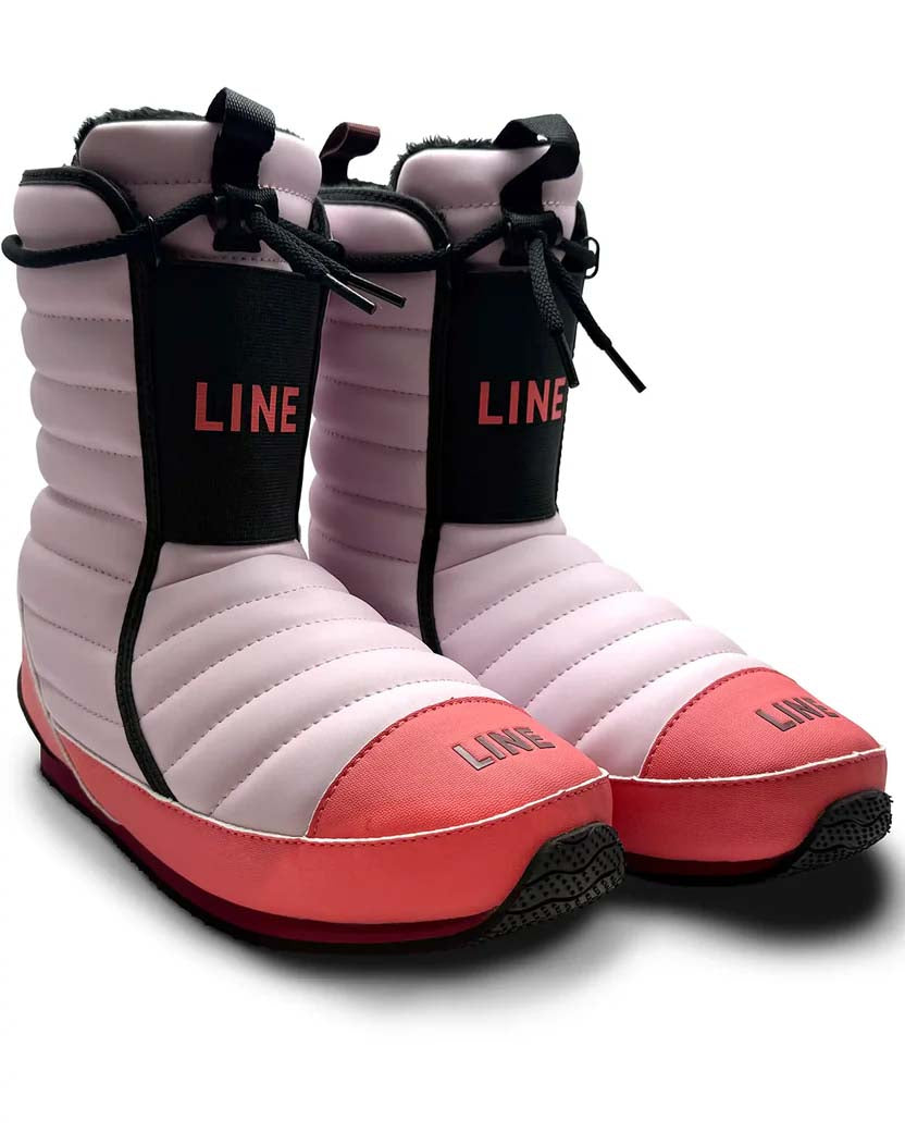 Bootie2- A single boot from the brand LINE, featuring a light pink quilted upper, a coral-pink toe and heel, and a black vertical strap with the brand name printed in coral-red.