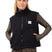 BoxySherpaVest-Person wearing a black vest with a brand logo, leopard print sleeves, pants, and beanie on a white background