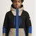 BoysTriBlockVesselJacket- Boy wearing a cream, black, and blue ski jacket 