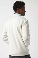 ButterTechFleece-Person wearing a white fleece against a white background
