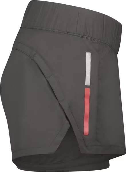 CarbonWomensShorts- Dark gray athletic shorts with an elastic waistband, featuring a white Swix logo on the lower left hem and red side piping details.