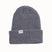 CoalTheStanleyBeanie-A dark gray ribbed knit beanie hat with a folded cuff, featuring a small white rectangular label on the front that reads 'coal'. The beanie is photographed against a clean, solid off-white background.