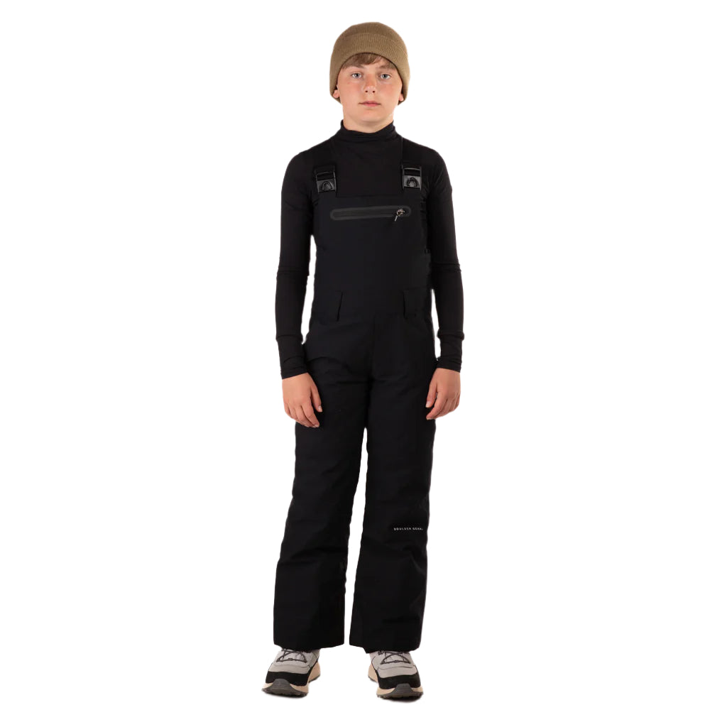 CooperBib-Person wearing a black snowsuit and beige beanie on a white background