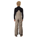 CooperBib-Person wearing beige bib overalls and a black long-sleeve shirt on a white background