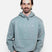 CorpoHoodie-Man wearing a light blue hoodie with 'LINE' branding on a white background