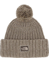 CozyChunkyCabinBeanie-Beige knit beanie with pom-pom and The North Face logo on a white background