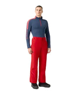 DescenteSmoothInsulatedMPant- Person wearing a blue top and red pants on a white background