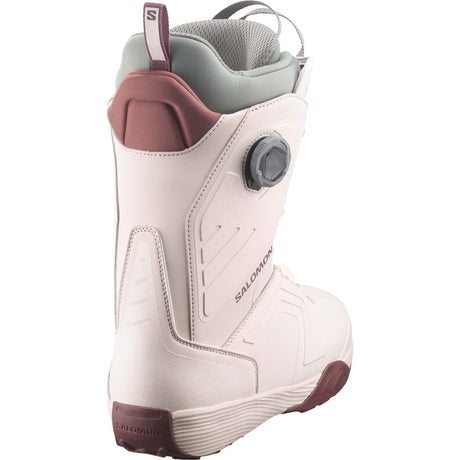Dialogue- Cream snowboard boot with maroon accents shown on a white background
