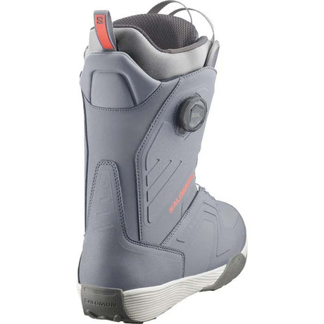 DialogueDualBOATeam- A Salomon snowboard boot in gray and black with a dial closure system and a small orange Salomon logo, shown against a plain white background.