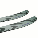 EQST92M11GW-Two green skis with black patterns and 'Salomon' branding on a white background