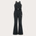 WTNPHarperSoftshellBib-Black ski jumpsuit with a belt on a light gray background