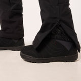 WTNPHarperSoftshellBib-Black ski jumpsuit with a belt on a light gray background
