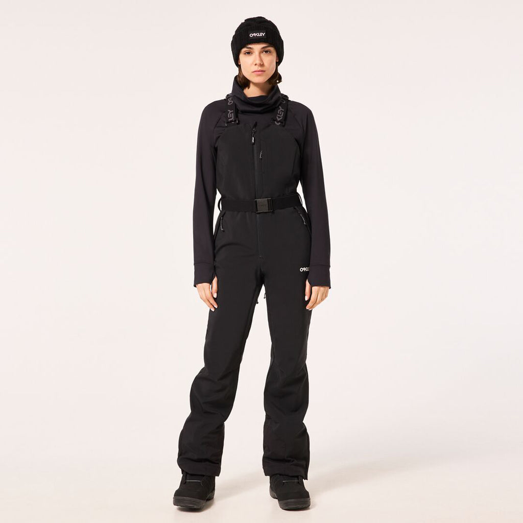 WTNPHarperSoftshellBib-Black ski jumpsuit with a belt on a light gray background