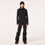 WTNPHarperSoftshellBib-Black ski jumpsuit with a belt on a light gray background