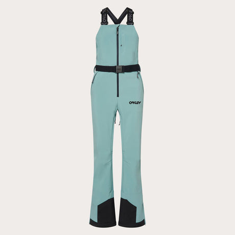 WTNPHarperSoftshellBib-Teal ski jumpsuit with a belt on a light gray background