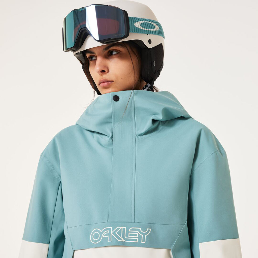 TNP TBT Insulated Anorak-Green and white jacket with Oakley logo on a light gray background