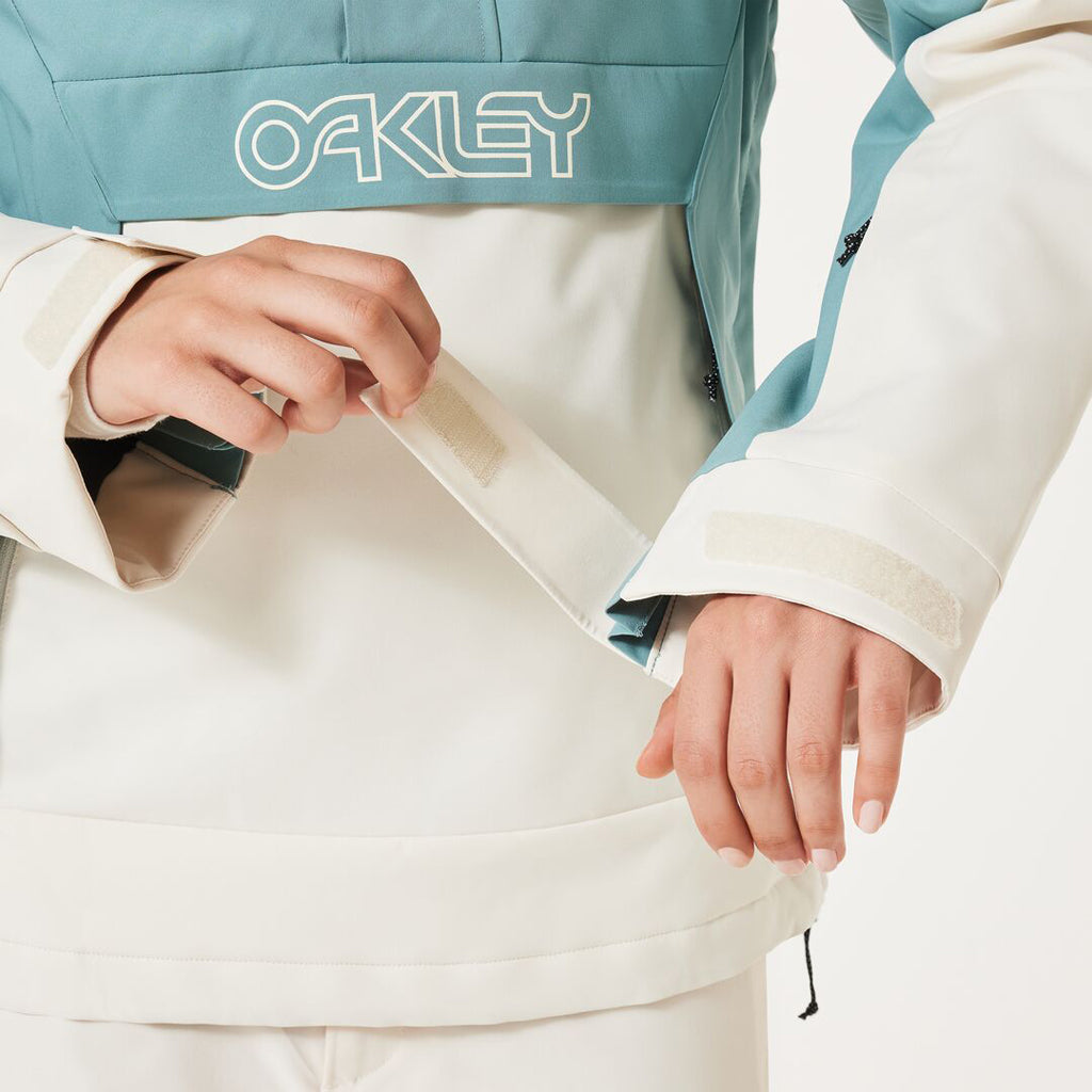TNP TBT Insulated Anorak-Green and white jacket with Oakley logo on a light gray background